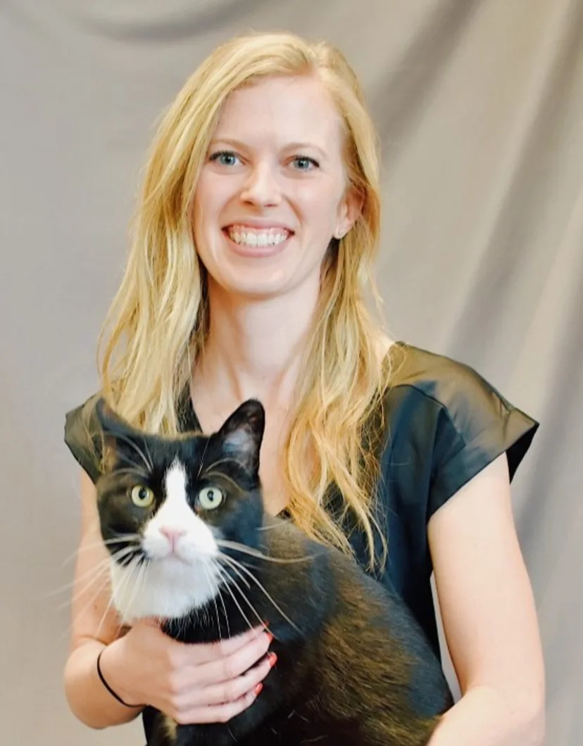Dr. Sarah Nelson sitting with a cat